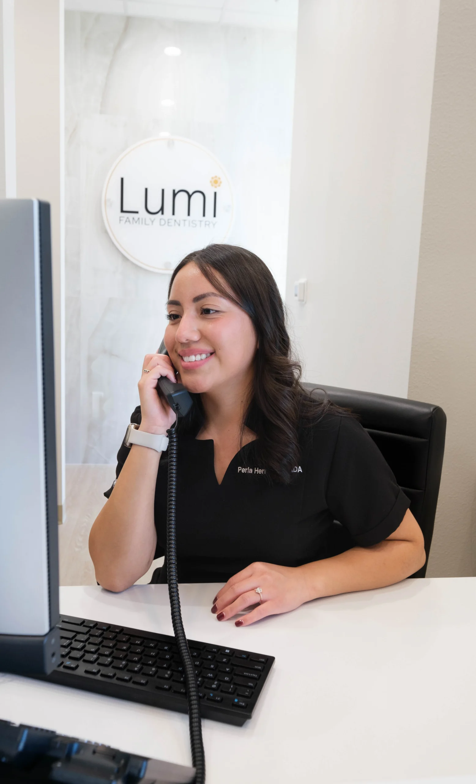 Lumi Dentistry assistant answering phone
